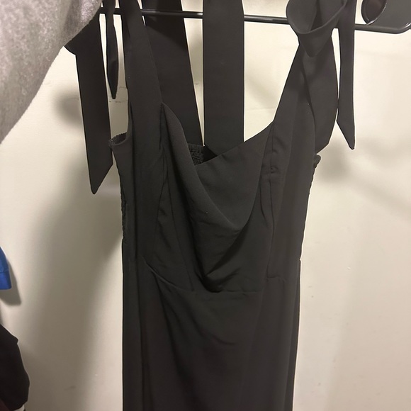 Black formal dress with slit. Hem hits mid-lower leg. Size medium. - Picture 4 of 6